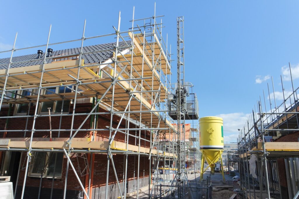 Construction site for new houses. Scaffolding